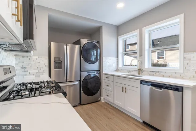 a kitchen with a stove and a sink