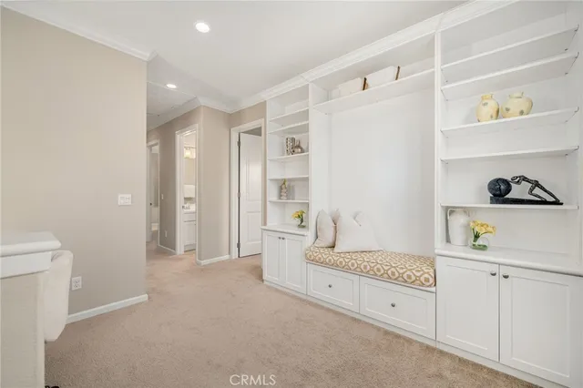 a spacious bathroom with a double vanity sink and a mirror