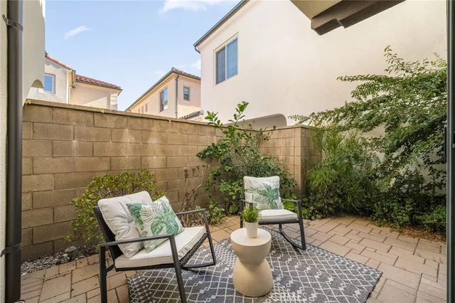 a view of a patio with a chairs and table in the patio