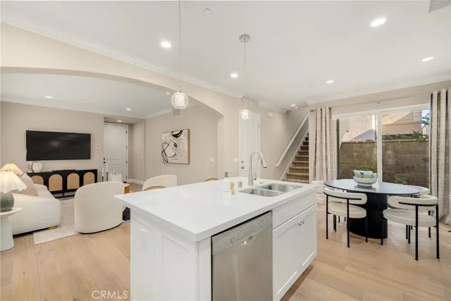 a view of living room with granite countertop furniture and a flat screen tv