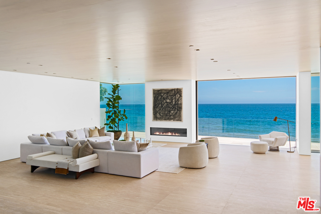 27234 Pacific Coast Highway Malibu, CA 90265 - Photo 13 of 54 a living room with furniture and potted plant