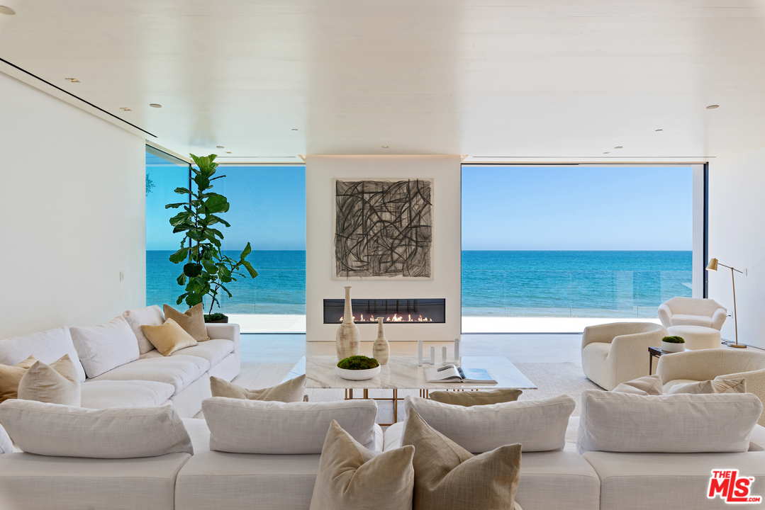 27234 Pacific Coast Highway Malibu, CA 90265 - Photo 14 of 54 a living room with furniture and a potted plant