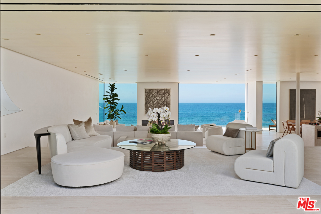 27234 Pacific Coast Highway Malibu, CA 90265 - Photo 17 of 54 a living room with furniture and a fireplace