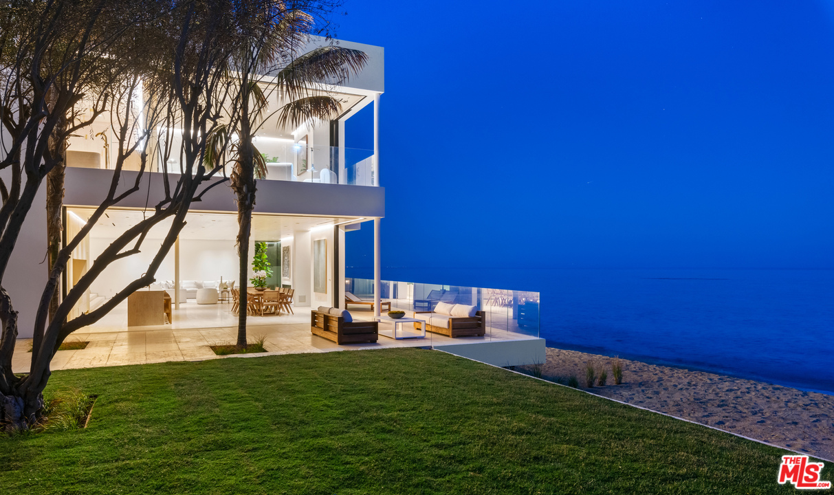 27234 Pacific Coast Highway Malibu, CA 90265 - Photo 2 of 54 a front view of a house with a yard