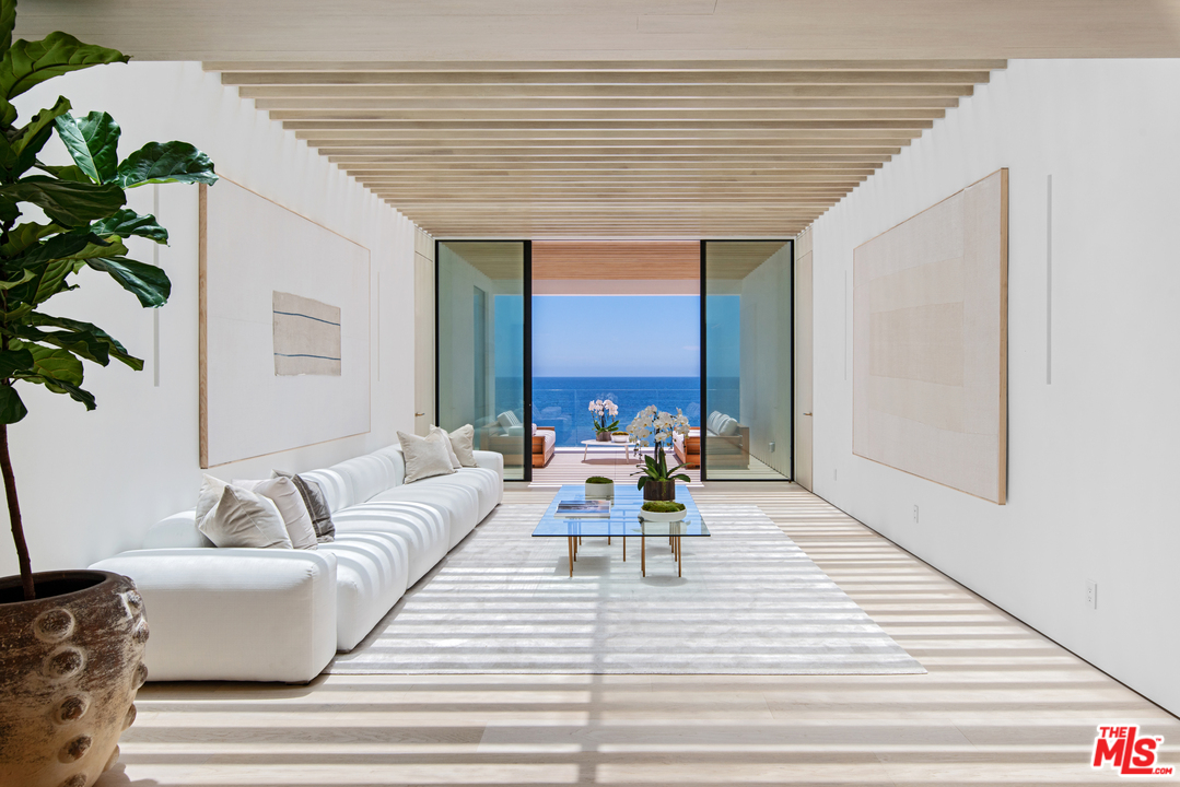 27234 Pacific Coast Highway Malibu, CA 90265 - Photo 23 of 54 a living room with furniture and a large window
