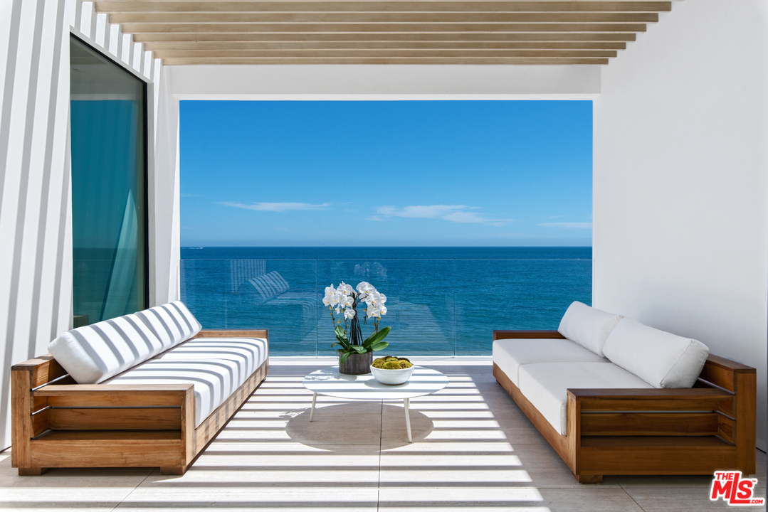 27234 Pacific Coast Highway Malibu, CA 90265 - Photo 24 of 54 a living room with furniture and a potted plant