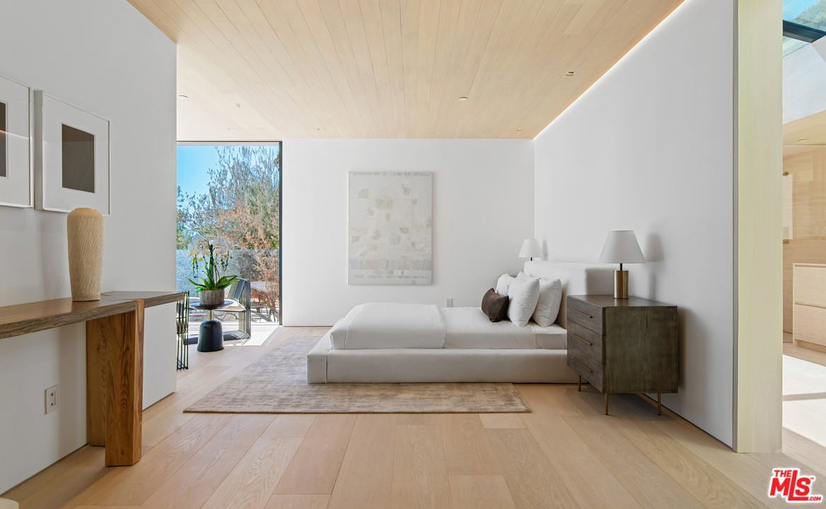 27234 Pacific Coast Highway Malibu, CA 90265 - Photo 29 of 54 a bedroom with furniture and a window