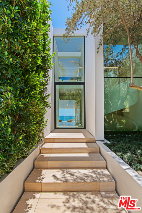 27234 Pacific Coast Highway Malibu, CA 90265 - Photo 3 of 54 a swimming pool with yard