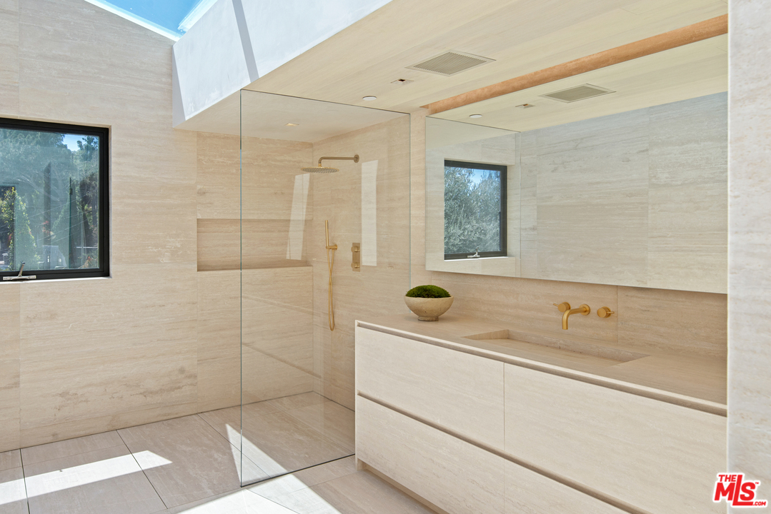 27234 Pacific Coast Highway Malibu, CA 90265 - Photo 31 of 54 a bathroom with a sink and a shower