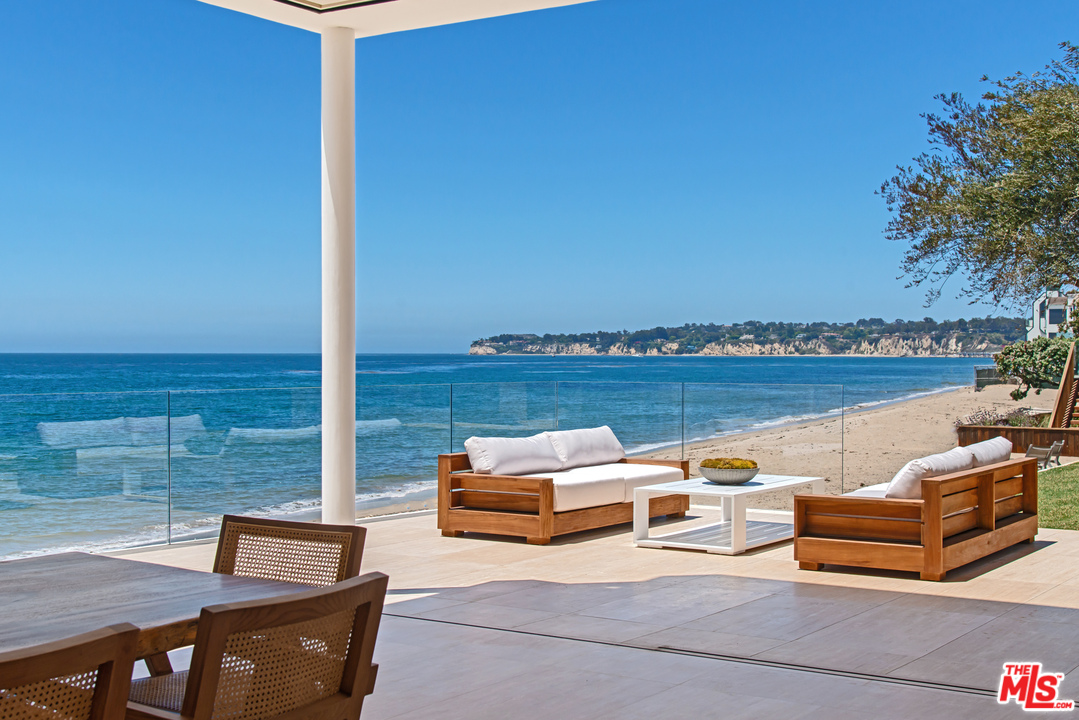 27234 Pacific Coast Highway Malibu, CA 90265 - Photo 5 of 54 a roof deck with couple of couches and potted plants