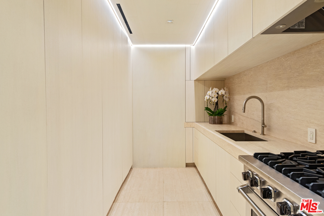 27234 Pacific Coast Highway Malibu, CA 90265 - Photo 43 of 54 a kitchen with a sink and cabinets