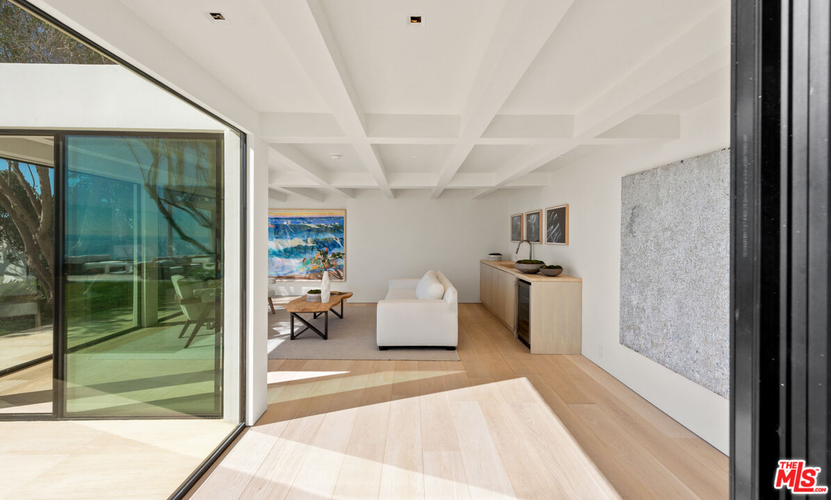 27234 Pacific Coast Highway Malibu, CA 90265 - Photo 45 of 54 a living room with furniture and a large window