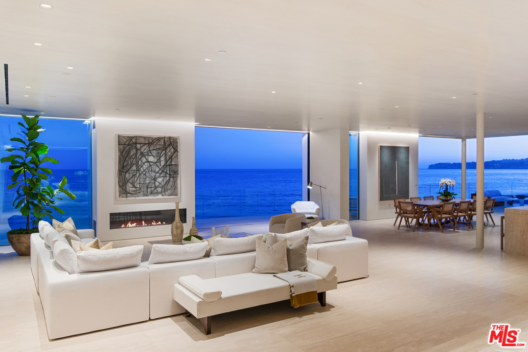 27234 Pacific Coast Highway Malibu, CA 90265 - Photo 48 of 54 a living room with furniture and flowers