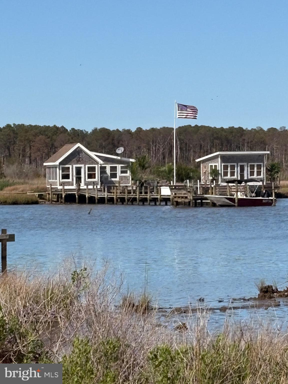 3336 Marsh Road Ewell, MD 21824 - Photo 17 of 42 a front view of a house with a yard