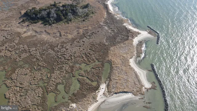 a aerial view of a house with a yard