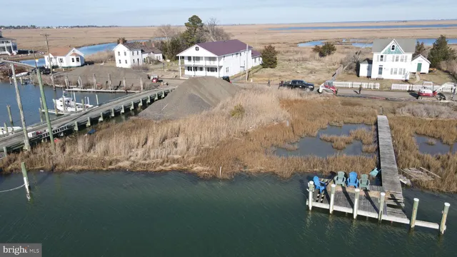 a table with wine bottles and glasses on it