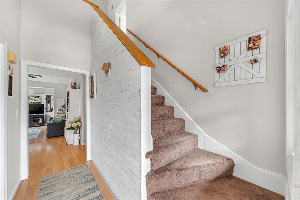 5 Weybridge Lane, Unit 5 Hopkinton, MA 01748 - Photo 16 of 34 a view of a hallway view with staircase