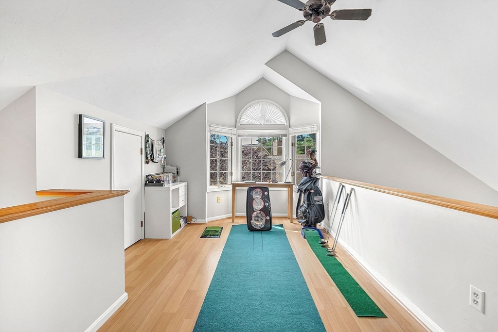 5 Weybridge Lane, Unit 5 Hopkinton, MA 01748 - Photo 17 of 34 a view of a room with window and hardwood floor