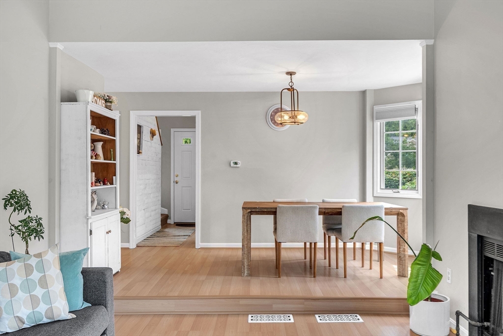 5 Weybridge Lane, Unit 5 Hopkinton, MA 01748 - Photo 2 of 34 a living room with furniture