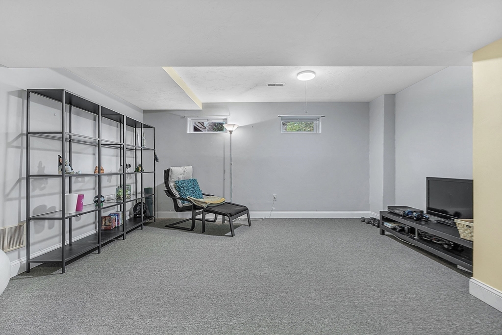 5 Weybridge Lane, Unit 5 Hopkinton, MA 01748 - Photo 27 of 34 a view of a room with gym equipment