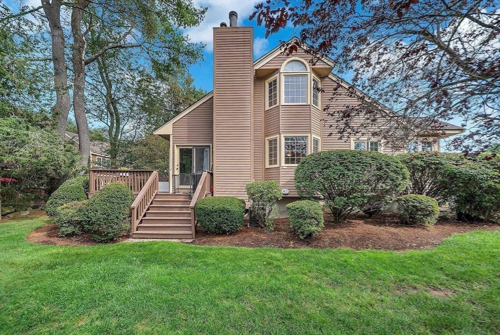5 Weybridge Lane, Unit 5 Hopkinton, MA 01748 - Photo 32 of 34 a view of house with backyard
