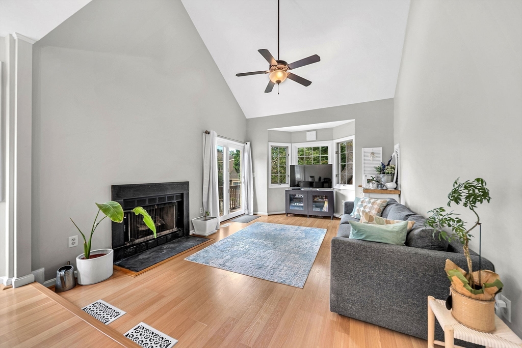 5 Weybridge Lane, Unit 5 Hopkinton, MA 01748 - Photo 5 of 34 a living room with furniture and a fireplace