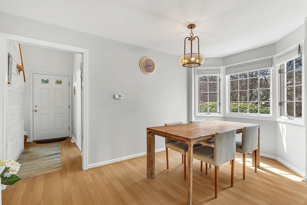 5 Weybridge Lane, Unit 5 Hopkinton, MA 01748 - Photo 7 of 34 a view of a dining room with a table and chairs