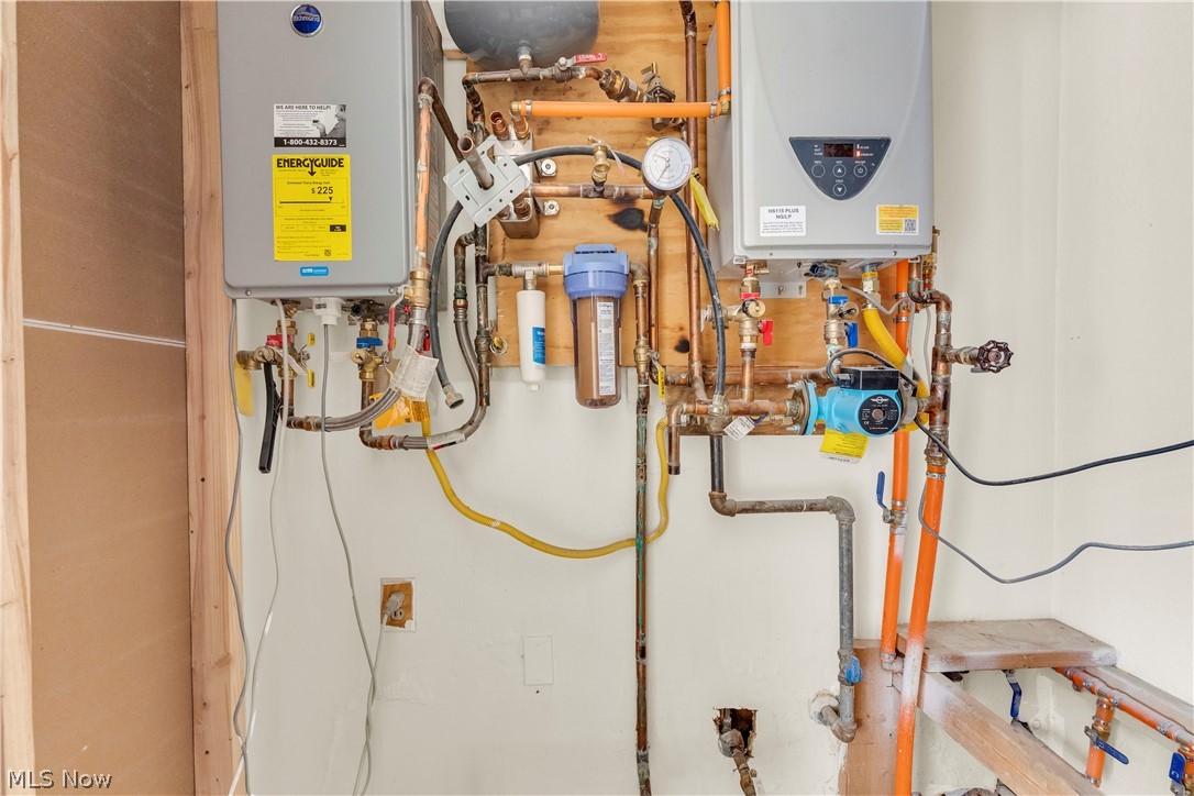 7320 Avon Belden Road North Ridgeville, OH 44039 - Photo 33 of 33 Utility room featuring tankless water heater