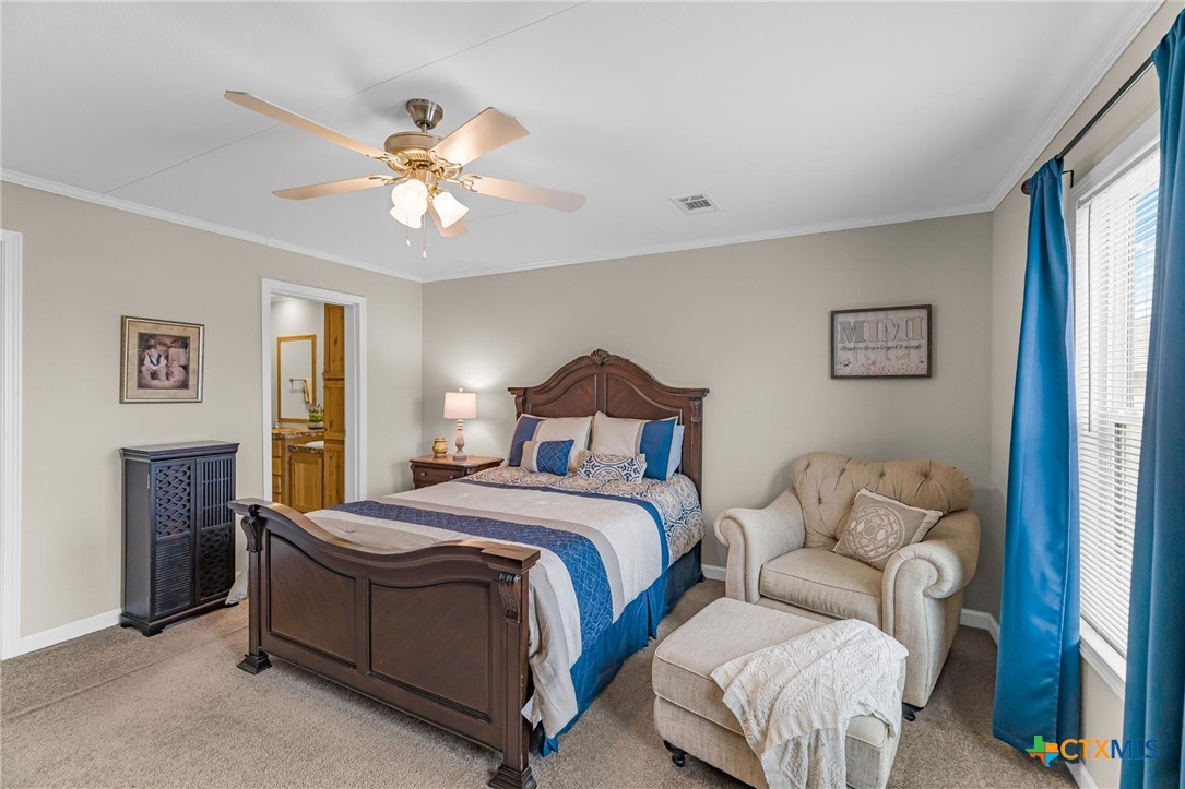 2610 Wendel Road Meyersville, TX 77974 - Photo 18 of 29 a spacious bedroom with a bed and window