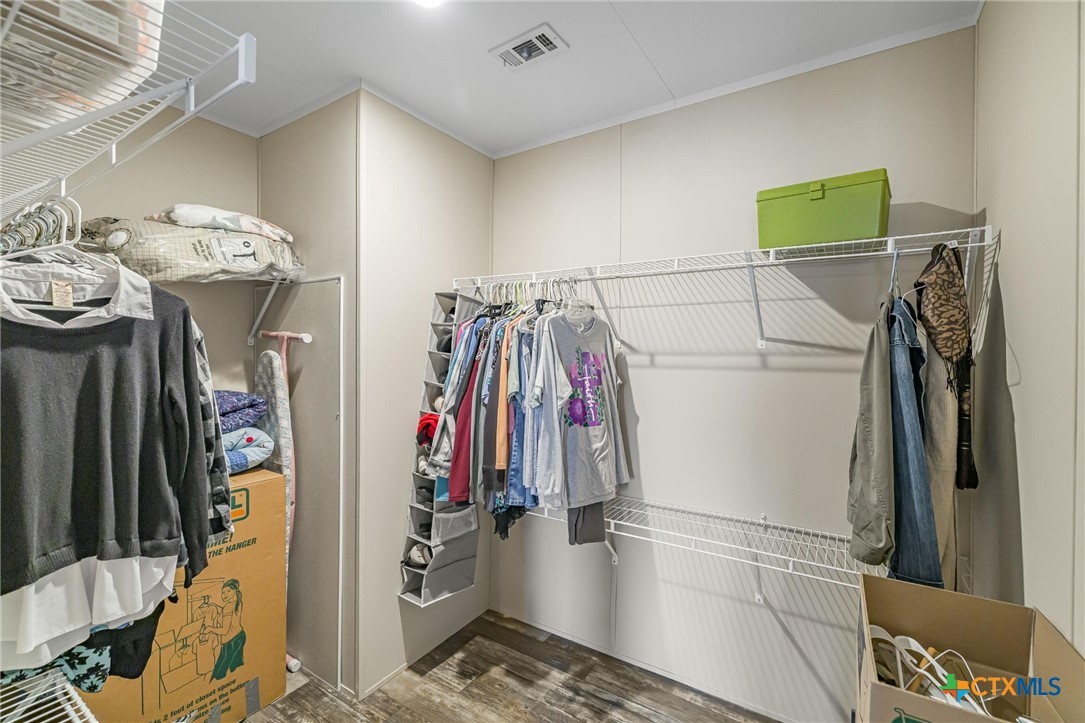 2610 Wendel Road Meyersville, TX 77974 - Photo 19 of 29 a view of walk in closet with clothes and shoes