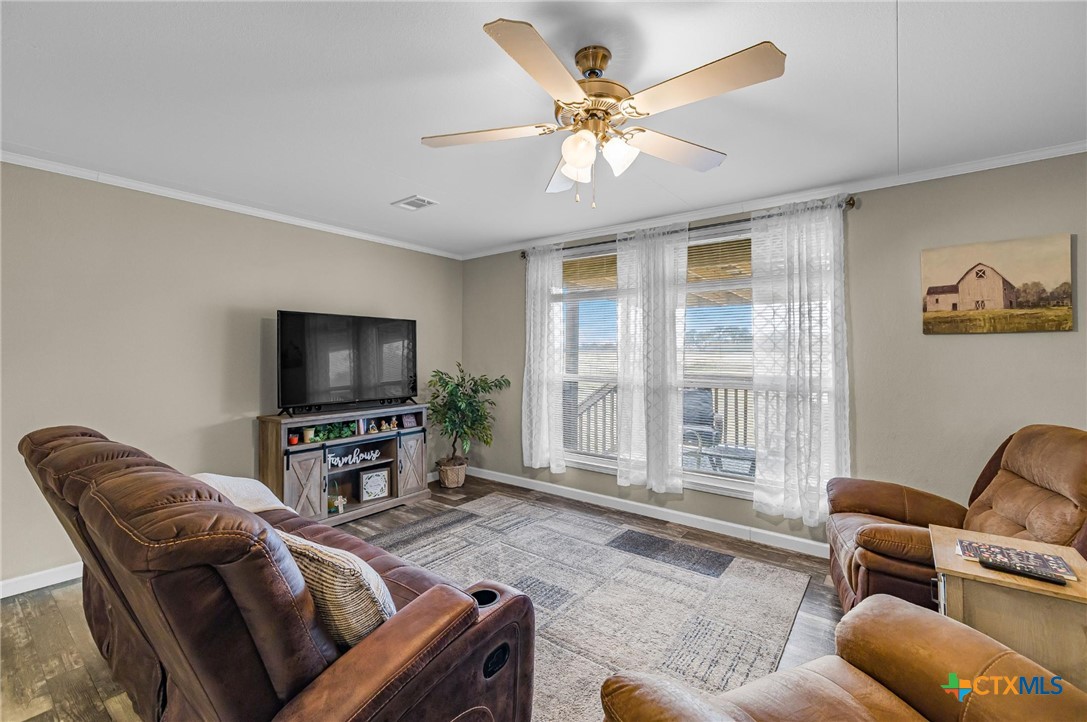 2610 Wendel Road Meyersville, TX 77974 - Photo 2 of 29 a living room with furniture and a flat screen tv