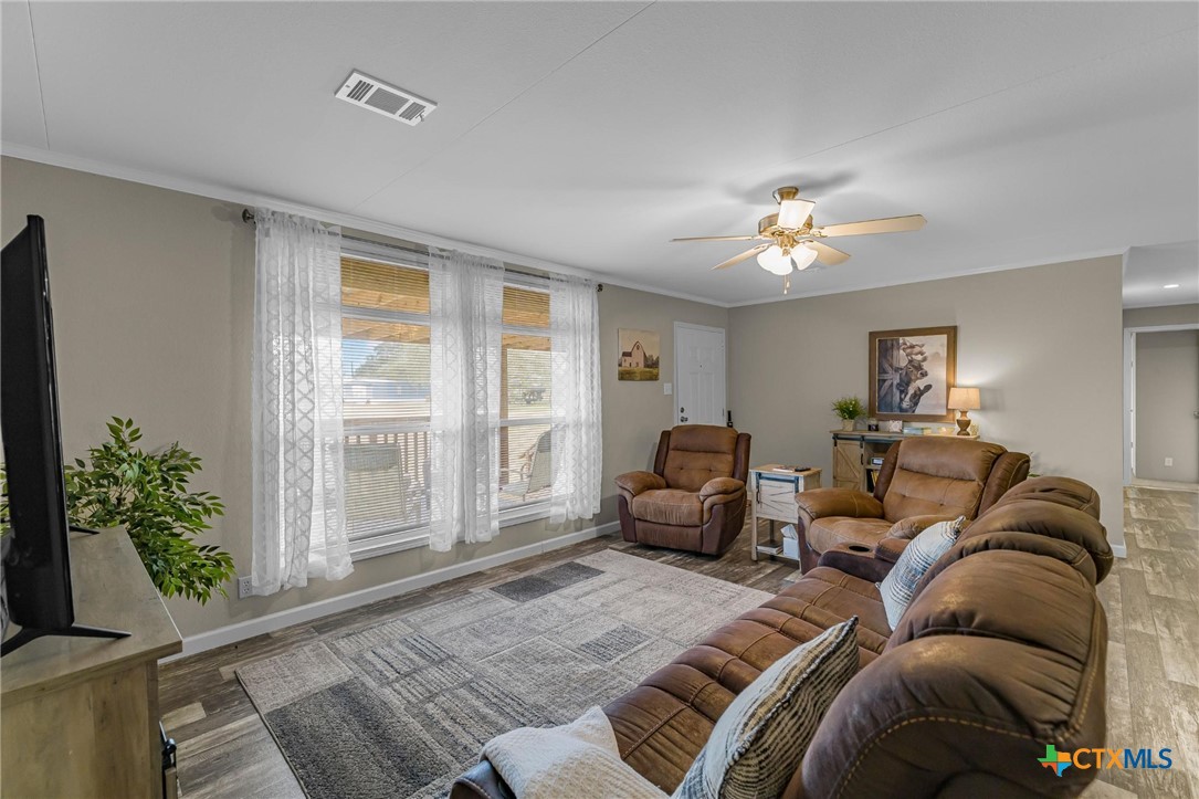 2610 Wendel Road Meyersville, TX 77974 - Photo 3 of 29 a living room with furniture and a potted plant