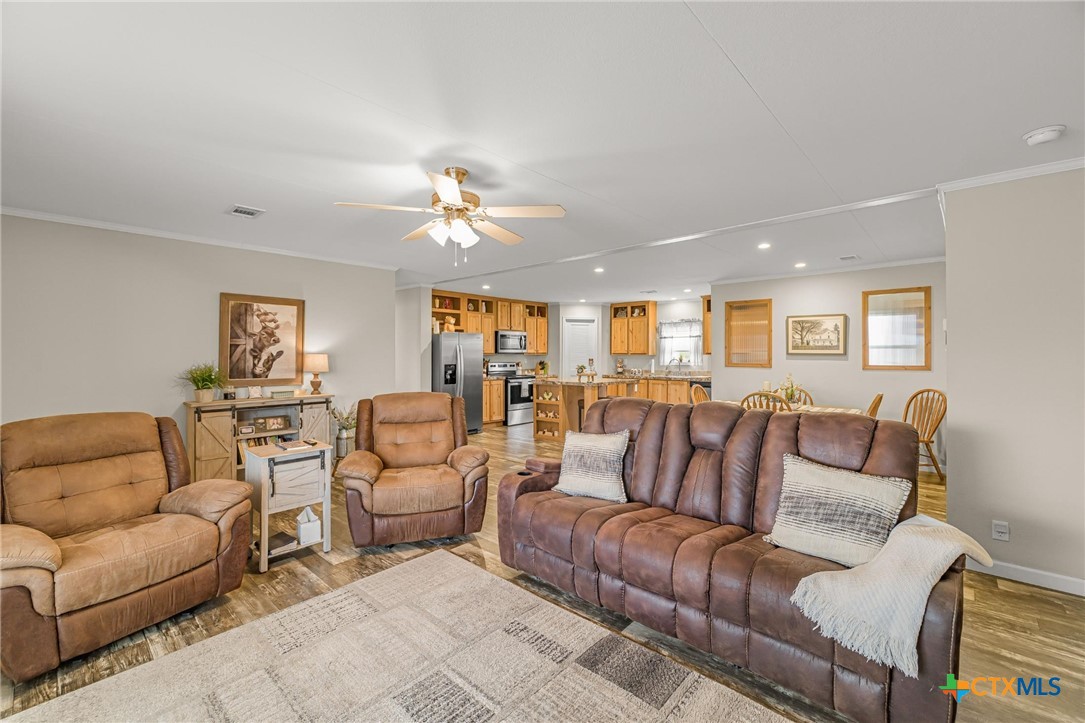 2610 Wendel Road Meyersville, TX 77974 - Photo 4 of 29 a living room with furniture ceiling fan and a rug