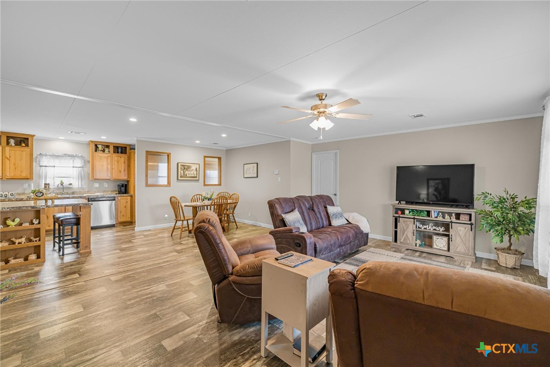 2610 Wendel Road Meyersville, TX 77974 - Photo 5 of 29 a living room with furniture and a flat screen tv