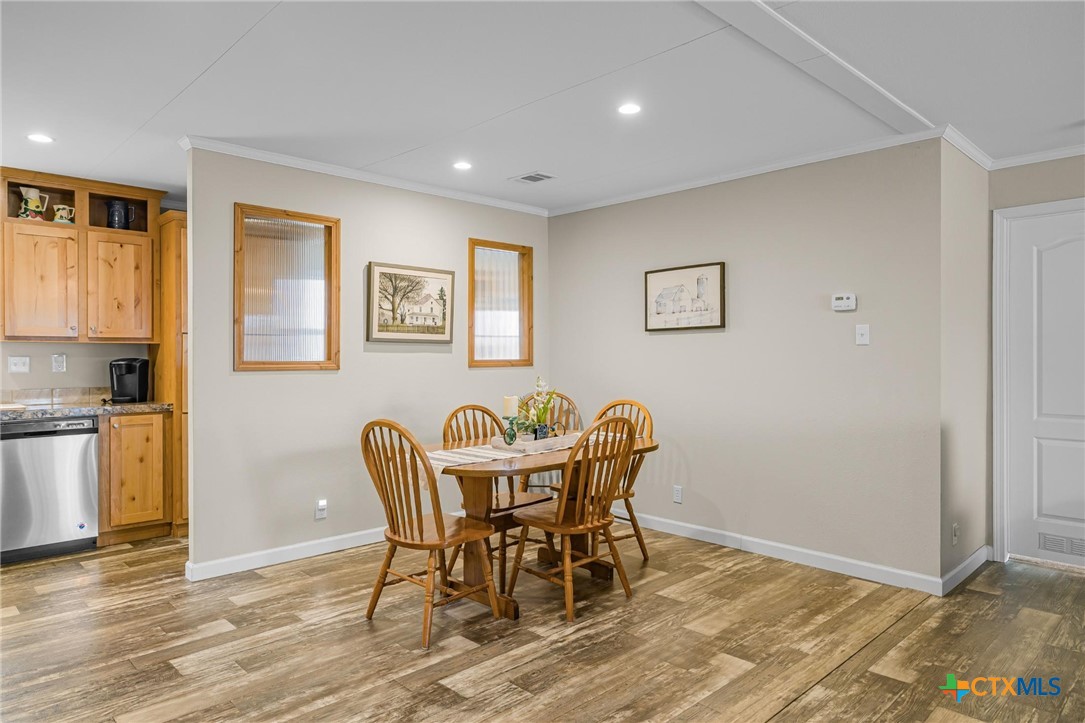 2610 Wendel Road Meyersville, TX 77974 - Photo 6 of 29 a view of a dining room with furniture and wooden floor