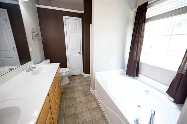 a en suite bathroom with a sink and a mirror