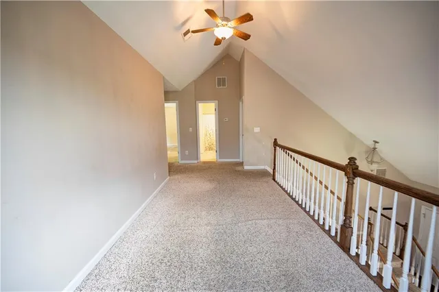 a view of a hallway with windows