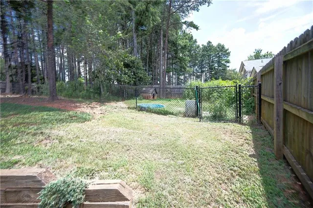 a view of a backyard with a small cabin