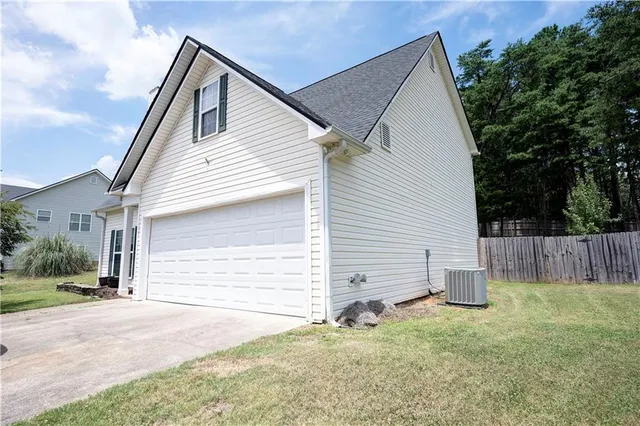 a view of a room with furniture and a flat screen tv