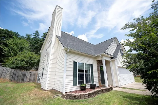 an aerial view of houses with yard