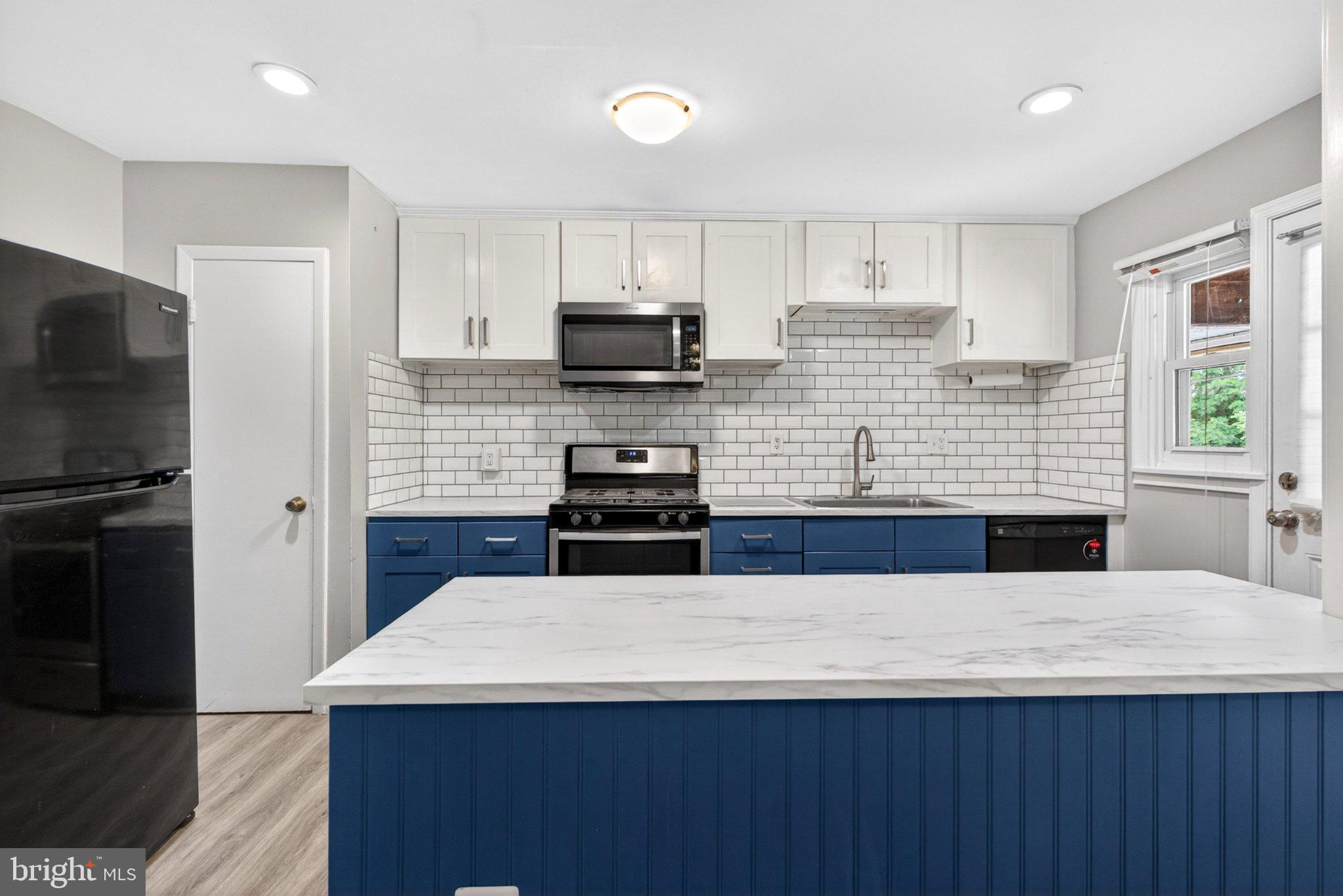 7729 Charlesmont Road Baltimore, MD 21222 - Photo 13 of 38 Modern kitchen with sleek finishes.