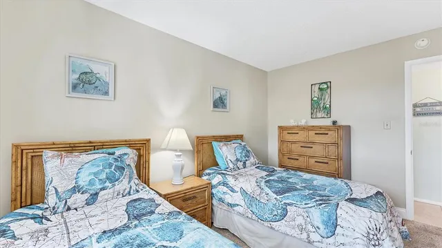 a bed room with furniture and mirror