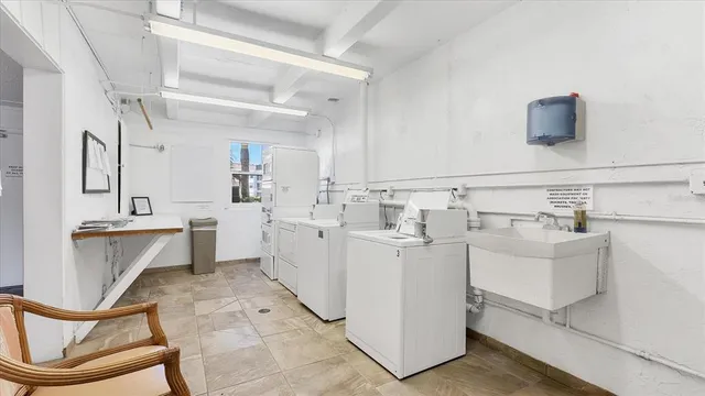 a utility room with cabinets