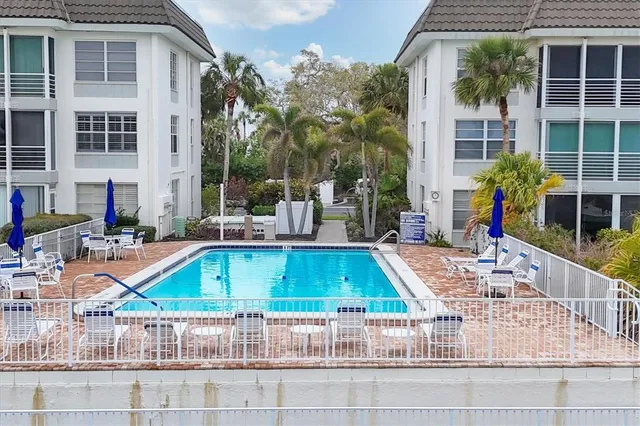a view of a swimming pool with a lounge chairs