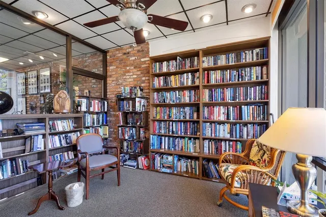 a room with furniture and book shelf