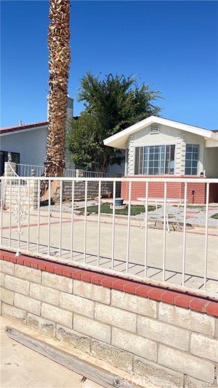 14515 Rivers Edge Road Helendale, CA 92342 - Photo 4 of 16 a view of a house with a backyard