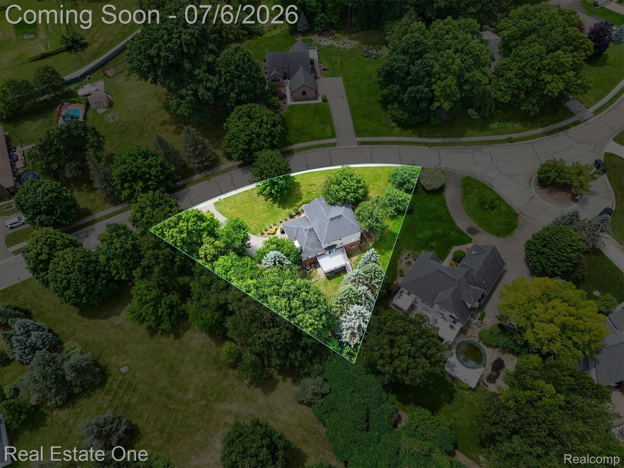 9610 Forest Ridge Drive Clarkston, MI 48348 - Photo 71 of 77 Nestled on a beautifully wooded, pie-shaped lot, this exceptional property offers the perfect blend of privacy, space, and neighborhood charm.