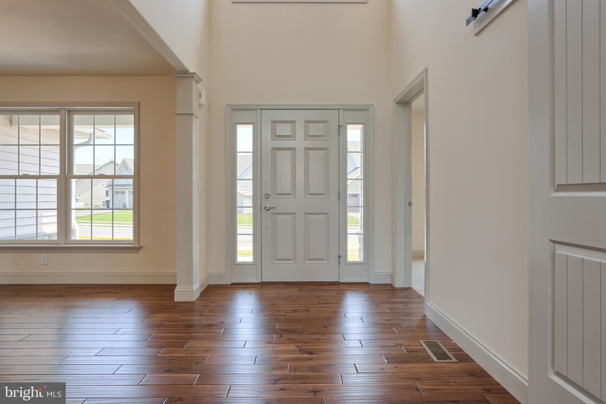 17 Rolling Meadow Road Lebanon, PA 17046 - Photo 2 of 41 wooden floor in an empty room with a window