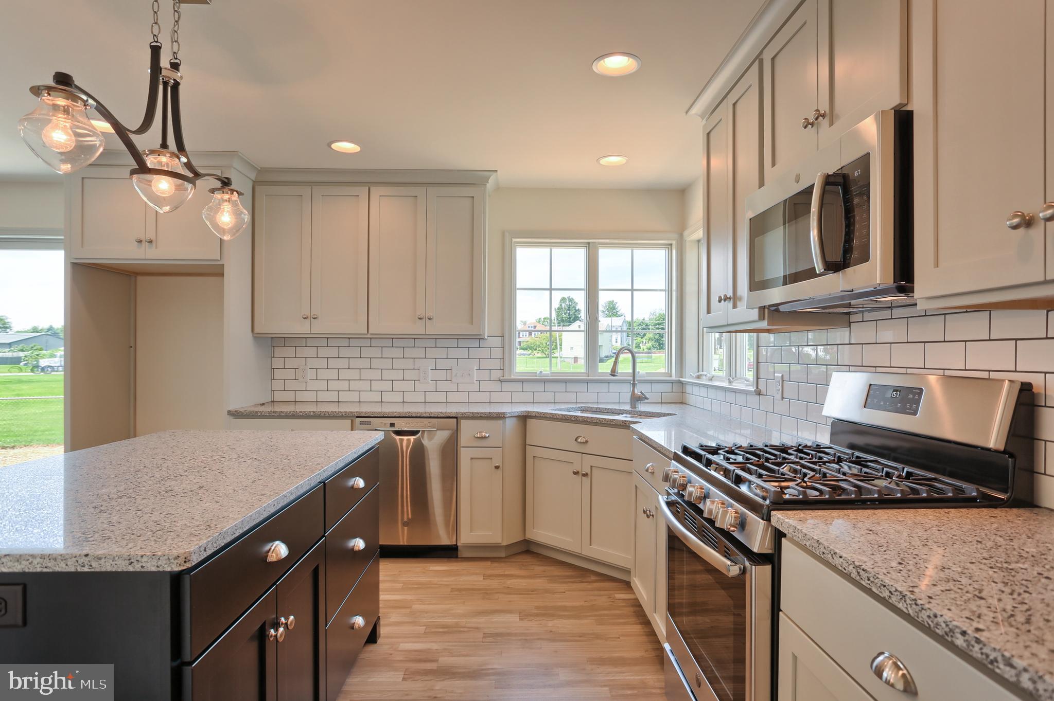 17 Rolling Meadow Road Lebanon, PA 17046 - Photo 23 of 41 a kitchen with stainless steel appliances granite countertop a sink stove and refrigerator