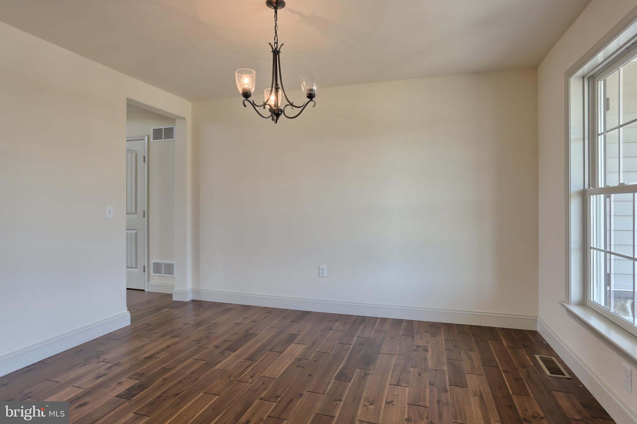 17 Rolling Meadow Road Lebanon, PA 17046 - Photo 8 of 41 wooden floor in an empty room with a window